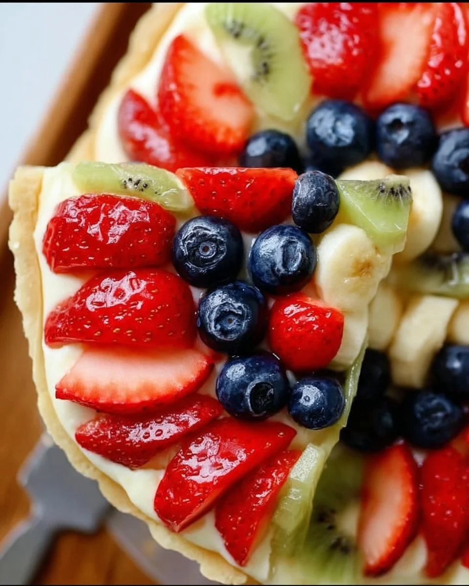 Colorful and delicious easy fruit pizza topped with fresh fruits.